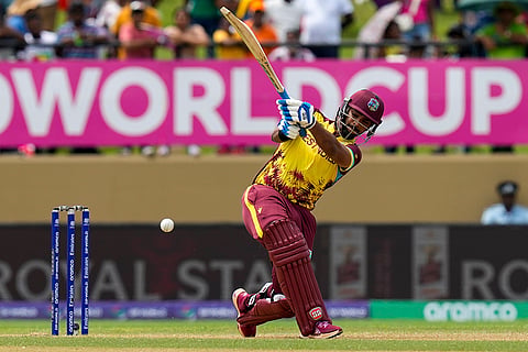Nicholas Pooran plays a shot against PNG